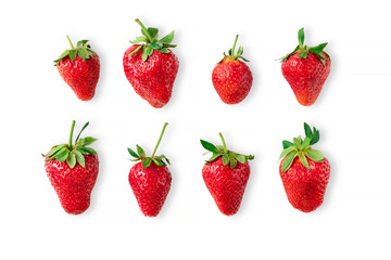 Eight different big ripe red strawberries laying on isolated white background