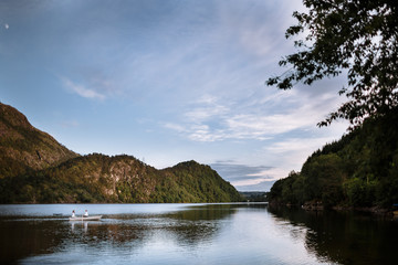 Wedding couple floating on a boat on the lake