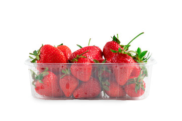 Heap of vivid saturated ripe red strawberries laying in big plastic transparent container and one big berry laying near the box isolated on clear white background - Powered by Adobe