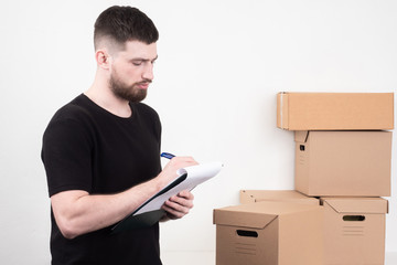 Delivery service. The man collects the order from the inventory. Home delivery of goods. The...