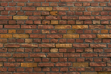 old, frayed yellow brick wall texture, background