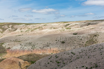 Landscape view of colorful mounds in South Dakota's Badlands National Park.