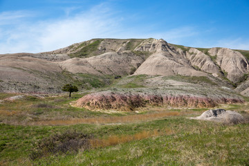 Landscape view of colorful mounds in South Dakota's Badlands National Park.