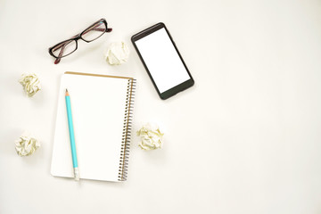 new ideas concept. notebook with copy space , paper balls, samrtphone, laptop, pencil.