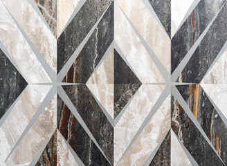 Dark gray porcelain tile with a rhomboid ornament. Background and texture of porcelain stoneware.