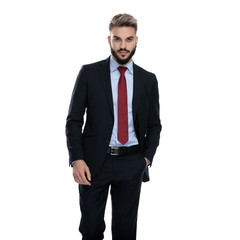sexy young businessman holding hands in pockets