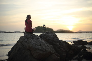 Women wait photography sunset at the beach