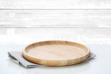 Wooden plate on table empty space wooden background,kitchen dish. - Powered by Adobe