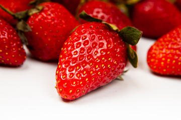 Fresh tasty strawberries on a white wooden table