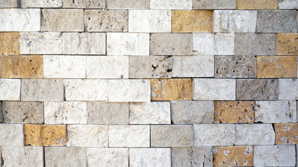 Colored stone wall cladding as background