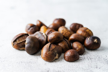 Chestnuts peeled and peeled in a white bowl