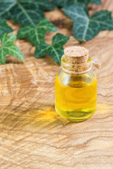 A bottle of vegetable oil on a beautiful textured wooden table. Omega-3-essential polyunsaturated fatty acids. Flaxseed oil in a bottle