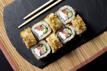 Sushi bonito roll on a dark background. Top view of sushi . Sushi food photo for menu.