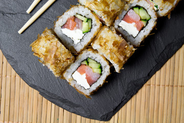 Sushi bonito roll on a dark background. Top view of sushi . Sushi food photo for menu.