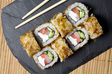 Sushi bonito roll on a dark background. Top view of sushi . Sushi food photo for menu.