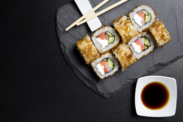 Sushi bonito roll on a dark background. Top view of sushi . Sushi food photo for menu.