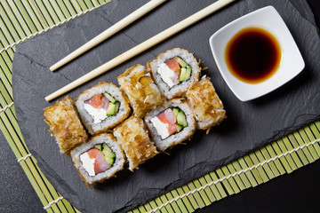 Sushi bonito roll on a dark background. Top view of sushi . Sushi food photo for menu.