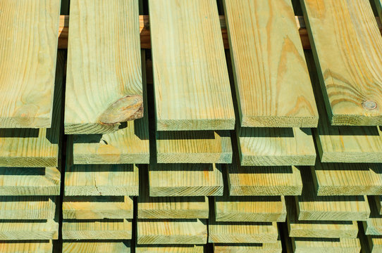 Opened with a green stain, the boards in parallel folded are dried. Background and wallpaper.