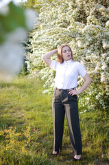 Happy girl with long hair walking in the spring