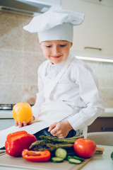 boy holding a fresh bell pepper