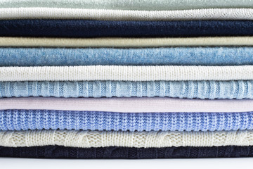 Pile of light pastel woolen clothes