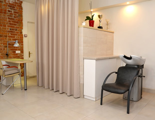 Fragment of beauty salon with hairdresser 's wash and attachment table