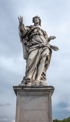 Fototapeta premium Full size ancient old statue of Angel with the Nails on Ponte Sant'Angelo in Rome near Castel Sant'Angelo