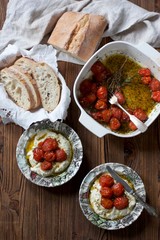 cheese snack with baked cherry tomatoes and ciabatta