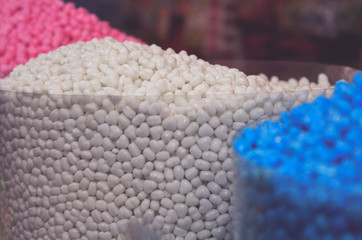 A lot of different candies on a market
