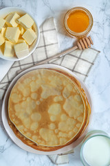 Pancakes top view on white background 