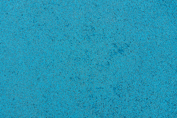 abstract background of blue soft coating texture on the playground close up