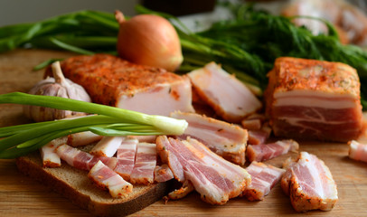 
bacon onion and bread on the table