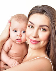 Mother and baby playing and smiling. Happy family.