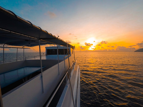 Passenger Craft In Sea Against Sky During Sunset