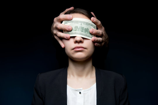 Business Woman Blinded By Money. Dollars Close Her Eyes