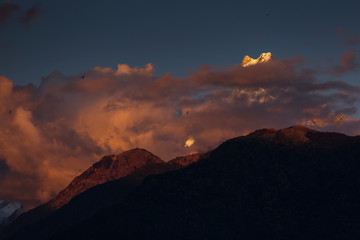 Landscape with Machapuchare-Fishtail peak at sunset view from Ghandruk during trekking in Himalaya Mountains, Nepal