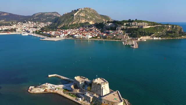 Aerial flight of Old Venetian fortress on the island of Bourtzi and Nafplion city 4k, Greece