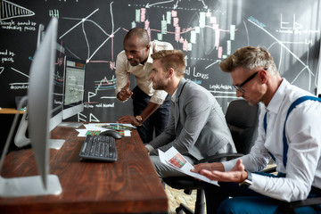 Today, tomorrow, together. Businessmen, traders in shirts discussing strategy and collaborative process in office. Diverse employees working in team on managing and marketing solution.
