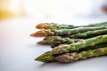 Fresh sprouts of asparagus isolated on white background. Fresh green asparagus on white. Asparagus. Raw asparagus. Fresh Asparagus.Green Asparagus.