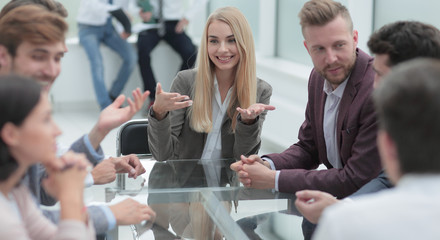 young business woman discusses her ideas with a business team.