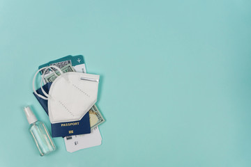 Coronavirus and travel. Immigration passport of citizen ID card with air tickets and face mask respirator and antiseptic. Epidemic Travel. 