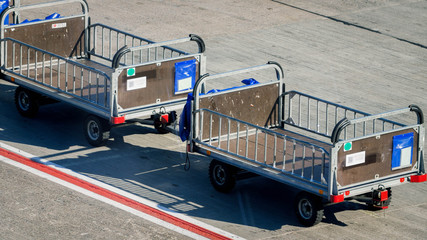 Naklejka premium Image of empty luggage transportration cart in empty airport because of global economy crisis caused by coronavirus and COVD-19 pandemic