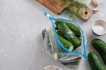 Salted, crunchy cucumbers with dill and garlic in a bag
