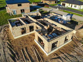 House under construction in construction site