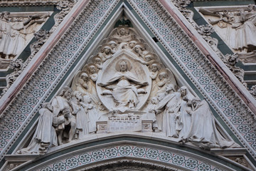Exterior / facade of the Cathedral of Santa Maria del Fiore in Florence, Italy. Close shot of decoration and art of the front fasade of the cathedral