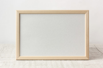 empty wooden frame with space for copying. light background.