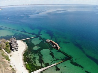 Wreck on a city beach, aerial view. City beach, Odessa, Ukraine