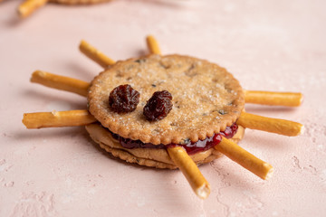 Halloween cookie spiders with peanut butter and jam