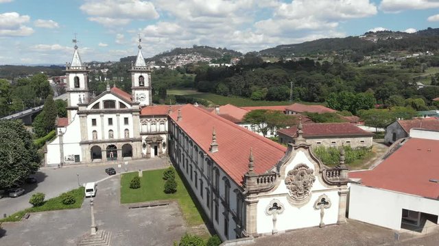 AERIAL DRONE FOOTAGE - The Monastery of St. Benedict (Sao Bento) in the city of Santo Tirso, Portugal, with the Ave River in the background. The Municipal Museum Abade Pedrosa.