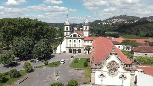 AERIAL DRONE FOOTAGE - The Monastery of St. Benedict (Sao Bento) in the city of Santo Tirso, Portugal, with the Ave River in the background. The Municipal Museum Abade Pedrosa.